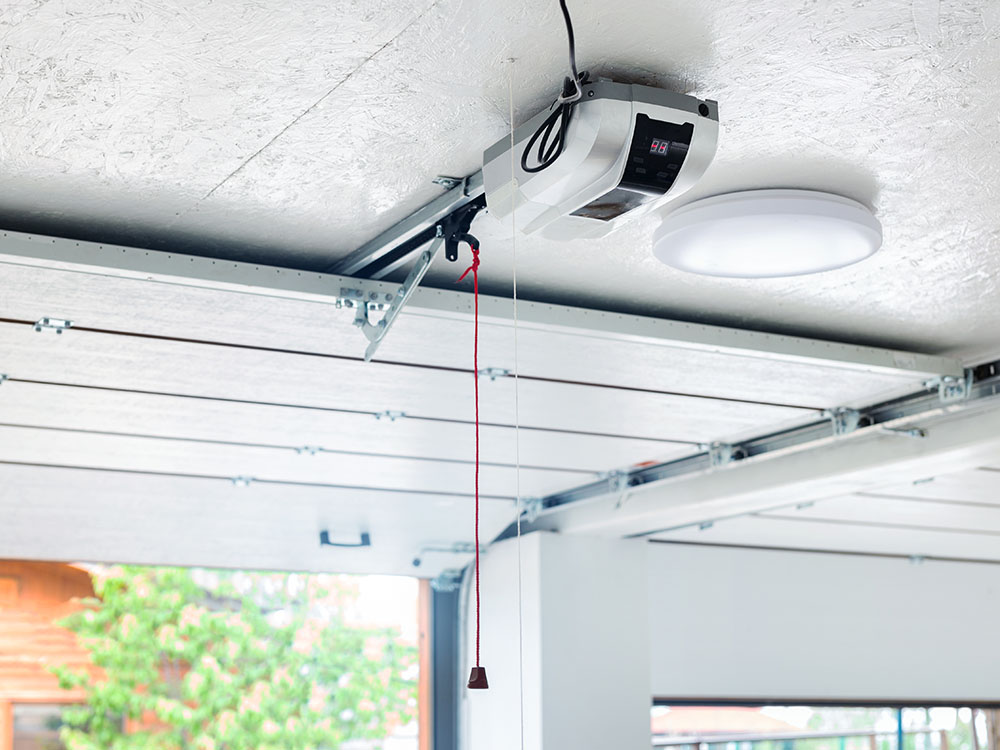 open garage from the inside showing garage door opener