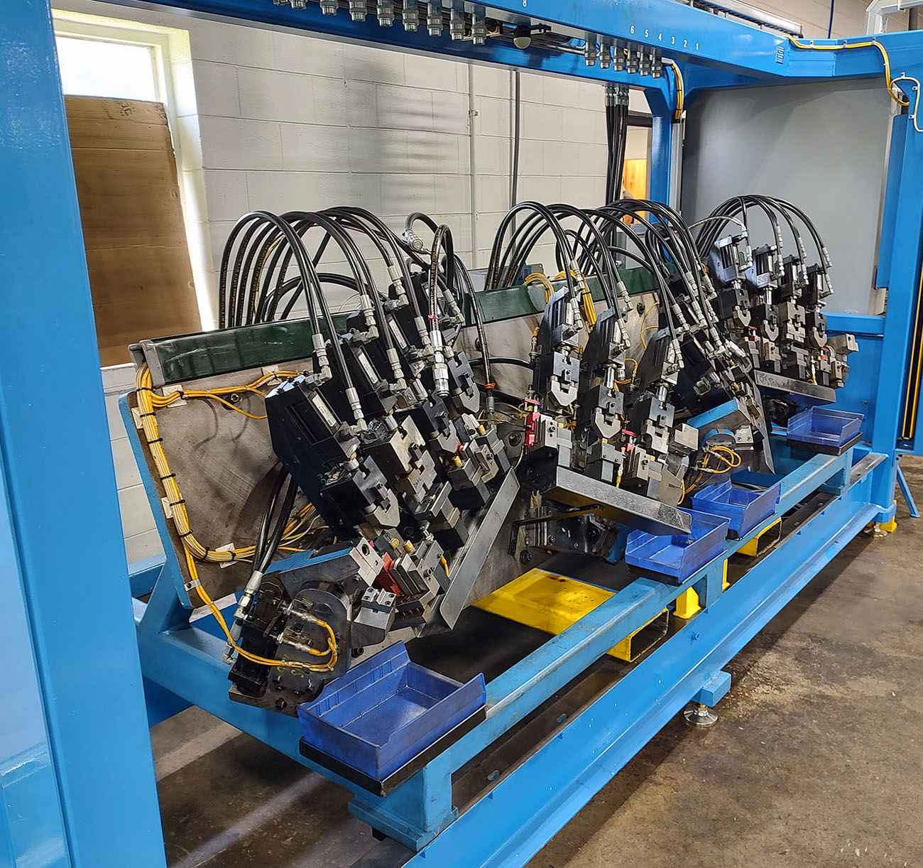 large blue and yellow stretch bending machine